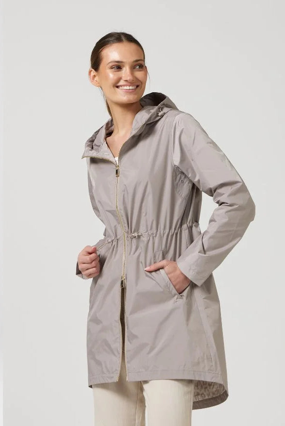 The Cairo Sands raincoat in beige, lightweight hooded waterproof raincoat ideal for South Africa’s rainy season and wet climate