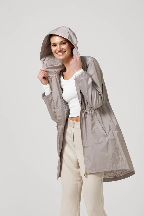 The Cairo Sands raincoat in beige, lightweight hooded waterproof raincoat ideal for South Africa’s rainy season and wet climate