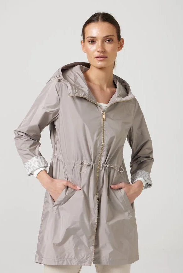 The Cairo Sands raincoat in beige, lightweight hooded waterproof raincoat ideal for South Africa’s rainy season and wet climate