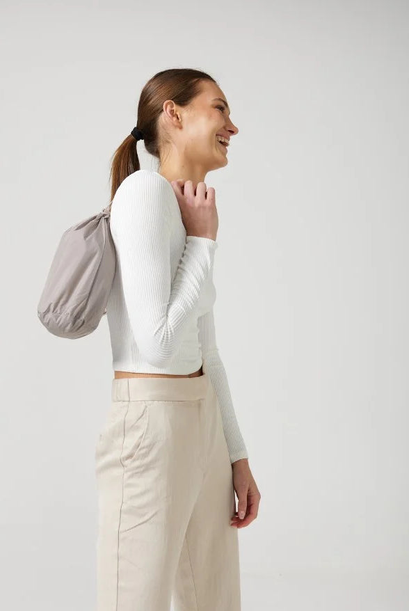 The Cairo Sands raincoat in beige, lightweight hooded waterproof raincoat ideal for South Africa’s rainy season and wet climate