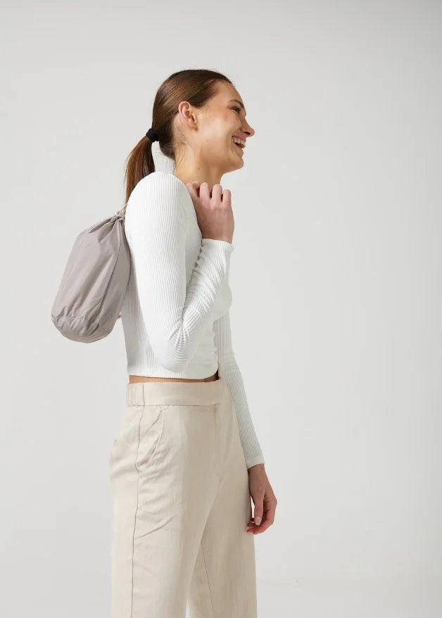 The Cairo Sands raincoat in beige, lightweight hooded waterproof raincoat ideal for South Africa’s rainy season and wet climate