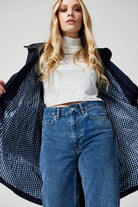 The Oxford Blue raincoat in navy blue, lightweight hooded waterproof raincoat ideal for South Africa’s rainy season and wet climate