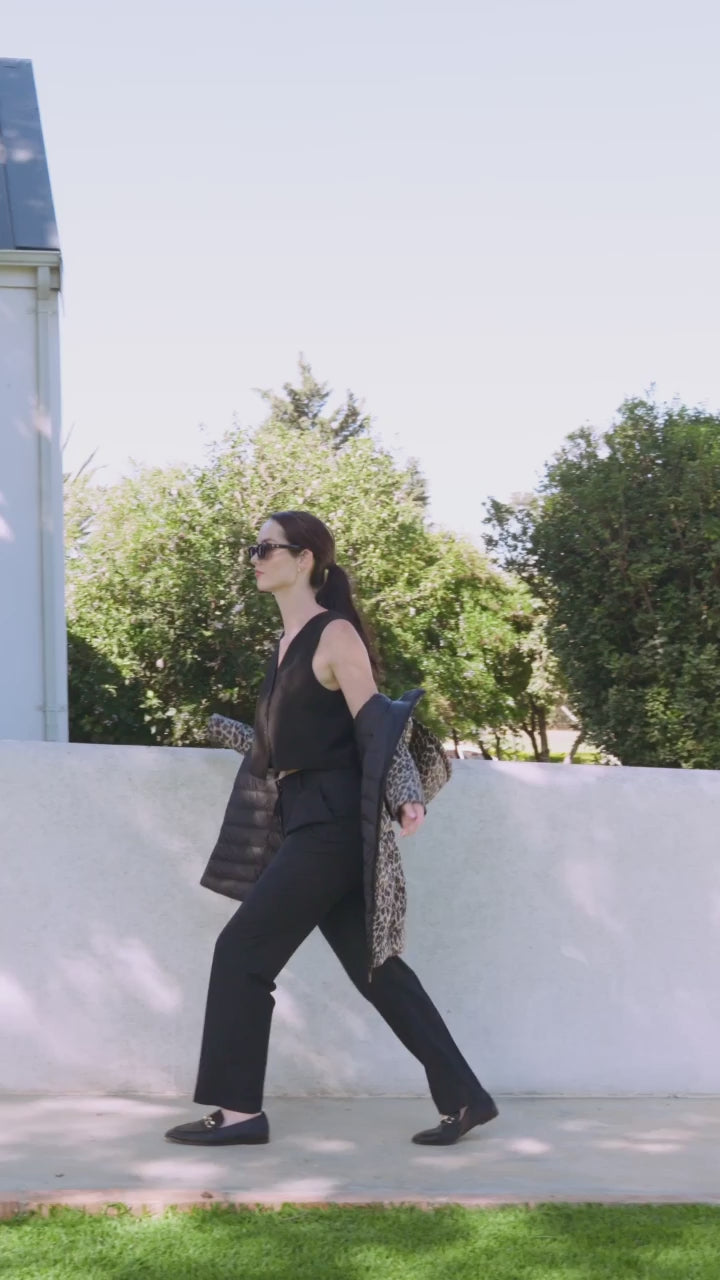 Women’s insulated reversible hooded parka in leopard print and midnight black, designed for warmth and comfort in South Africa’s winter season — Midnight x Leopard Classic Parka™