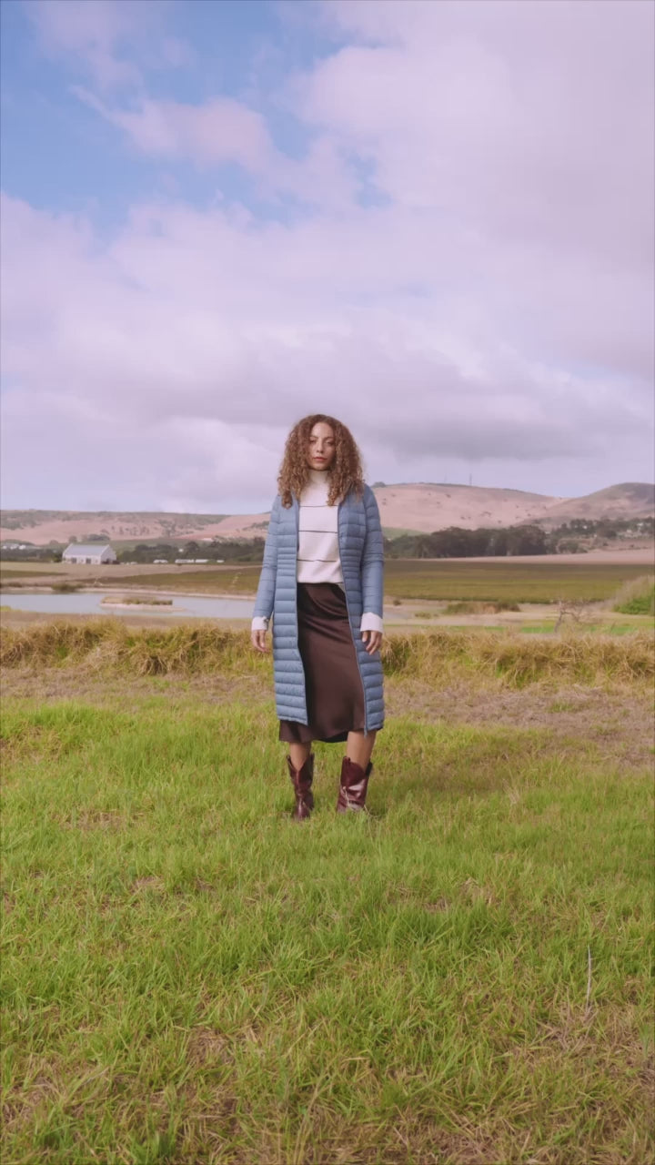 Women’s insulated ultra-length hooded parka in sky blue, designed for extra warmth and comfort in South Africa’s winter season — Vista Ultra Parka™