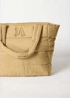 Puffer Tote Bag — quilted tan tote with padded handles, detachable shoulder strap,