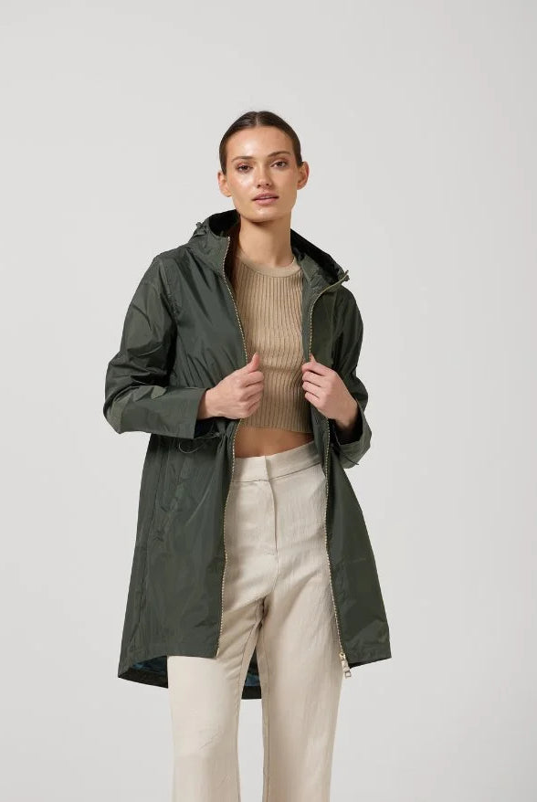 The Juniper raincoat in deep green, lightweight hooded waterproof raincoat ideal for South Africa’s rainy season and wet climate