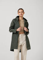 The Juniper raincoat in deep green, lightweight hooded waterproof raincoat ideal for South Africa’s rainy season and wet climate