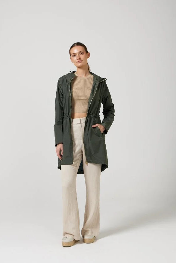 The Juniper raincoat in deep green, lightweight hooded waterproof raincoat ideal for South Africa’s rainy season and wet climate