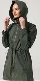 The Juniper raincoat in deep green, lightweight hooded waterproof raincoat ideal for South Africa’s rainy season and wet climate