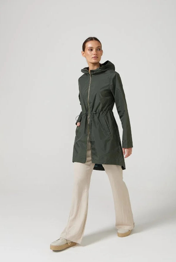The Juniper raincoat in deep green, lightweight hooded waterproof raincoat ideal for South Africa’s rainy season and wet climate