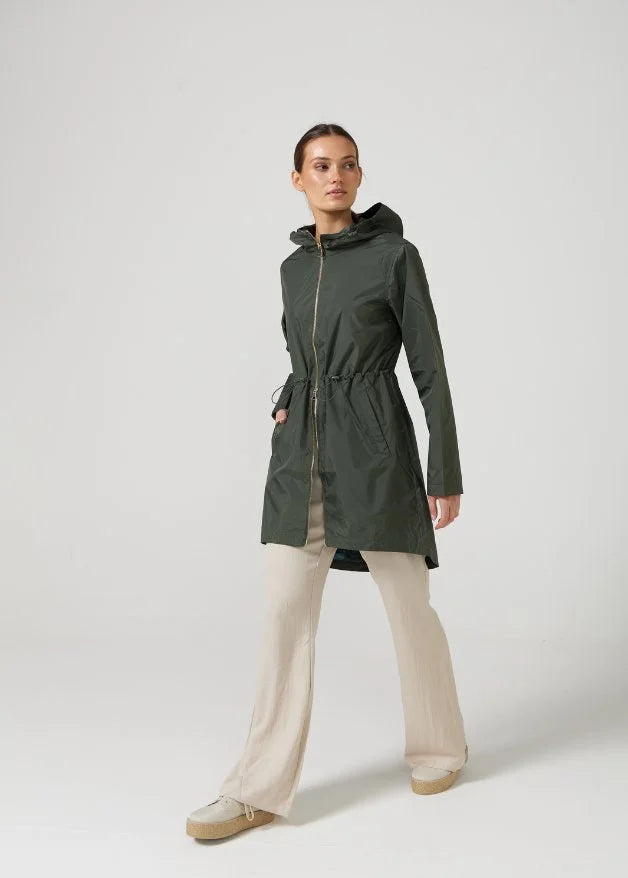 The Juniper raincoat in deep green, lightweight hooded waterproof raincoat ideal for South Africa’s rainy season and wet climate