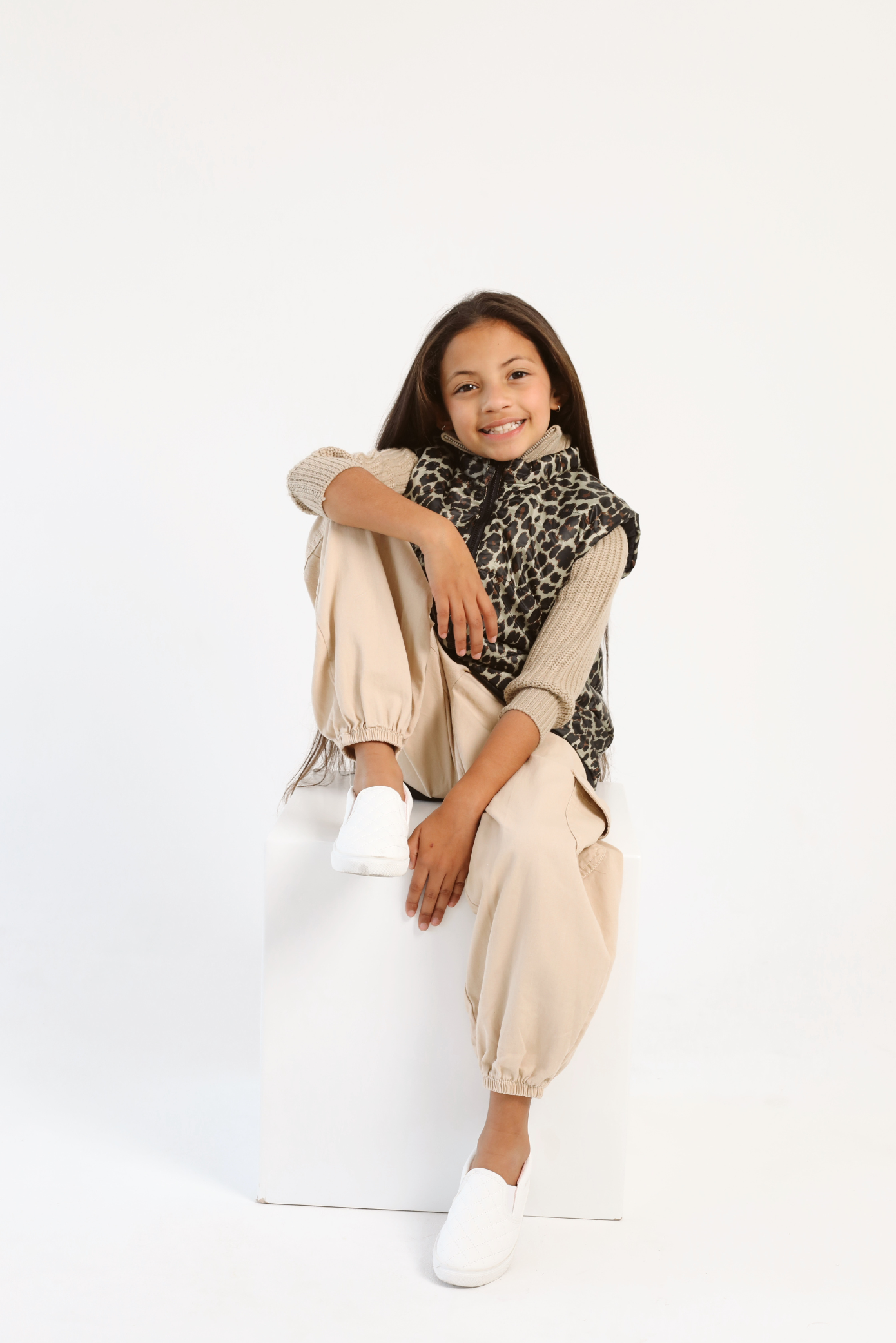 Kids Leopard x Black Gilet™ — sleeveless kids’ puffer vest in bold leopard print with black accents, a fun winter essential in South Africa