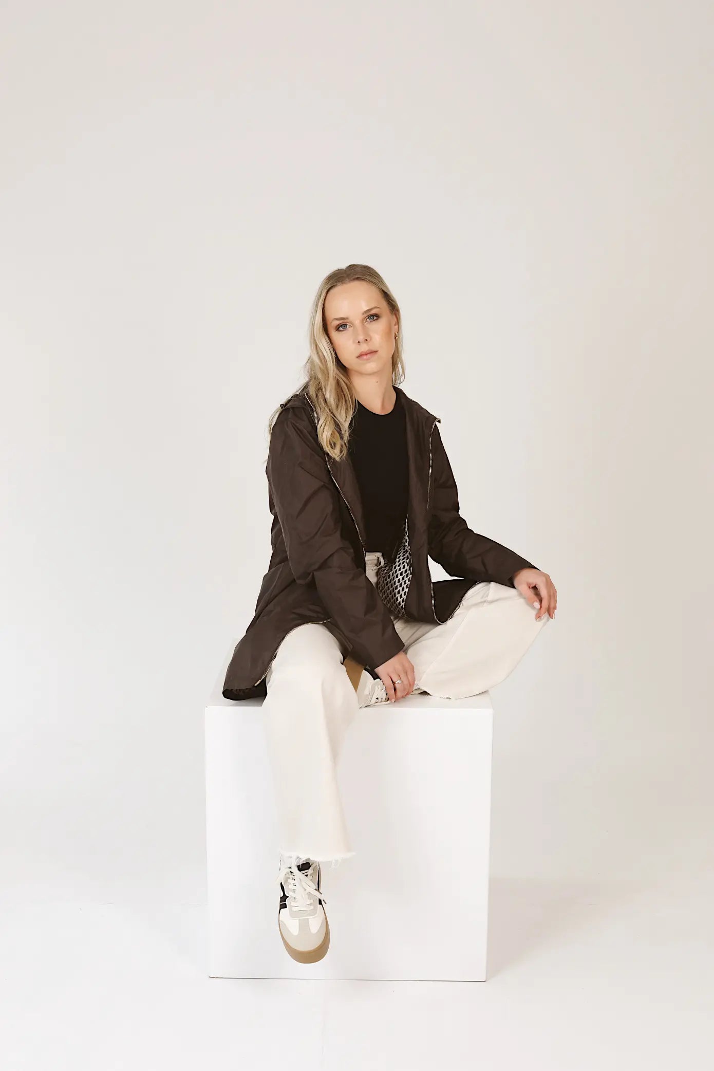 Truffle Haze raincoat in dark brown, lightweight hooded waterproof raincoat ideal for South Africa’s rainy season and wet climate