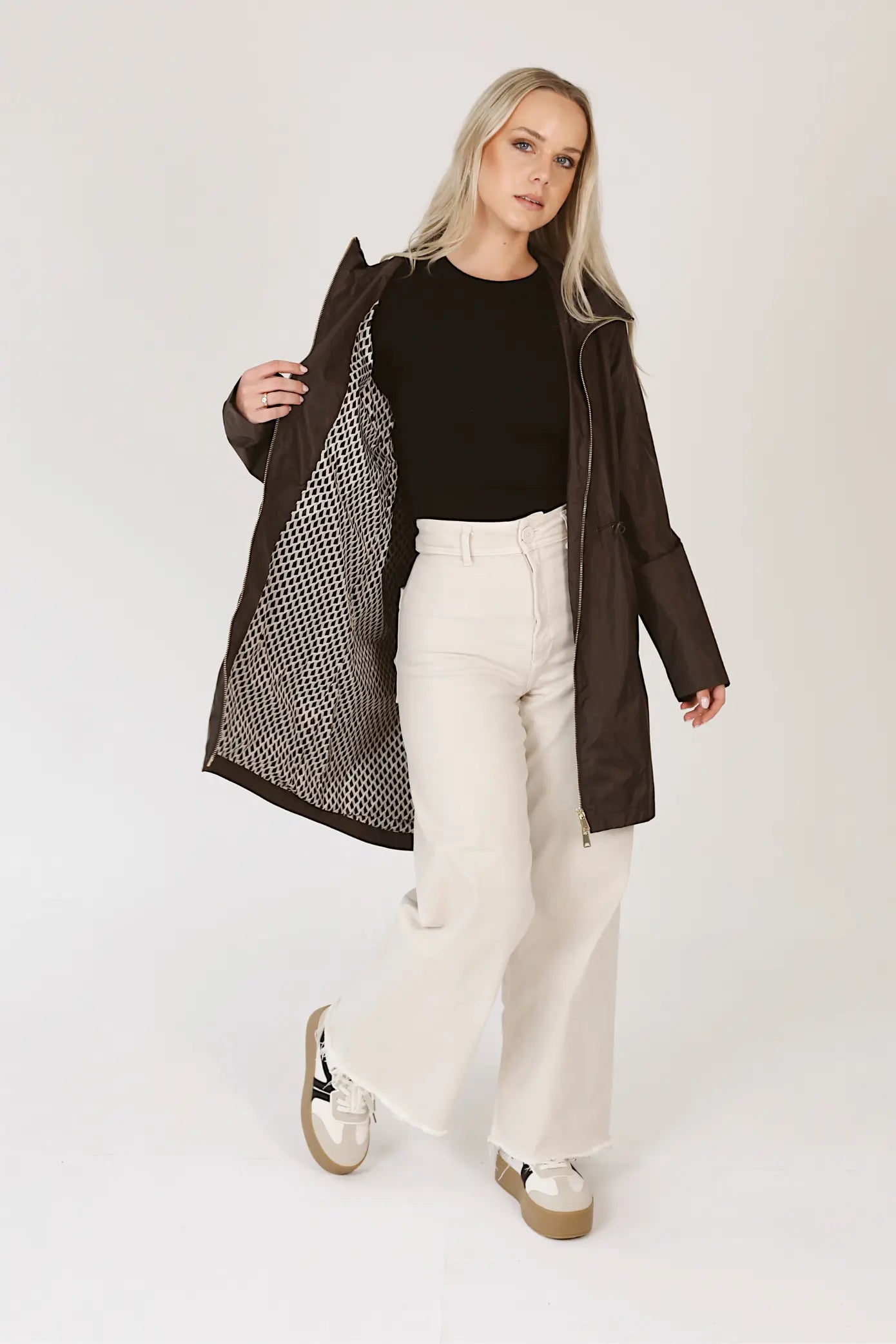 Truffle Haze raincoat in dark brown, lightweight hooded waterproof raincoat ideal for South Africa’s rainy season and wet climate