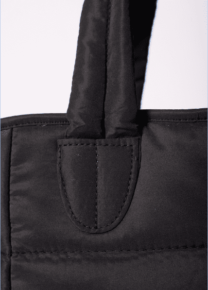 details of black puffer tote bag