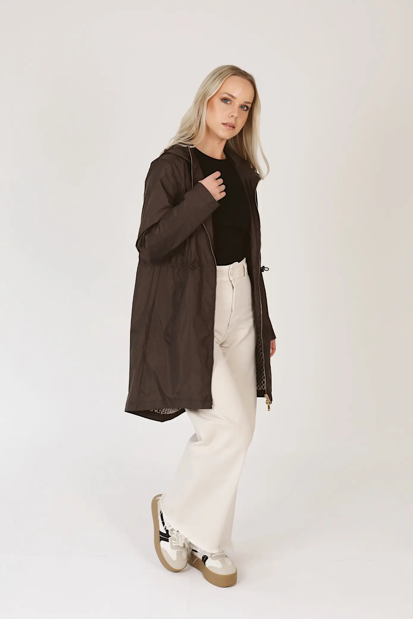 Truffle Haze raincoat in dark brown, lightweight hooded waterproof raincoat ideal for South Africa’s rainy season and wet climate