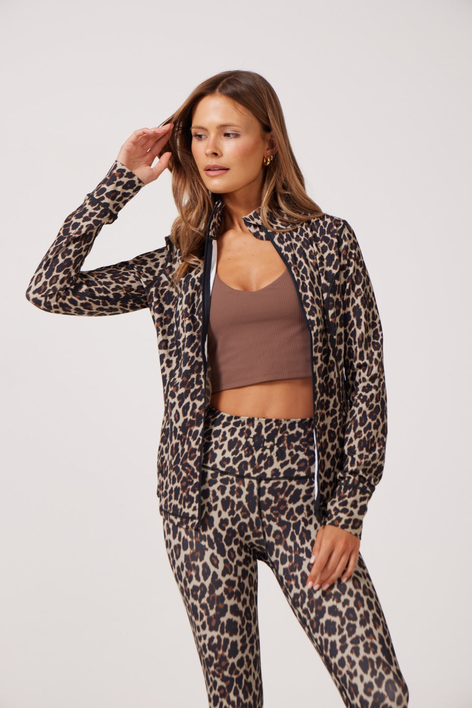 Leopard Lightweight performance jacket with a smooth, sculpting fit, full zip front, high collar, and stretch fabric designed for everyday movement and layering.