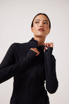 Black Lightweight performance jacket with a smooth, sculpting fit, full zip front, high collar, and stretch fabric designed for everyday movement and layering.