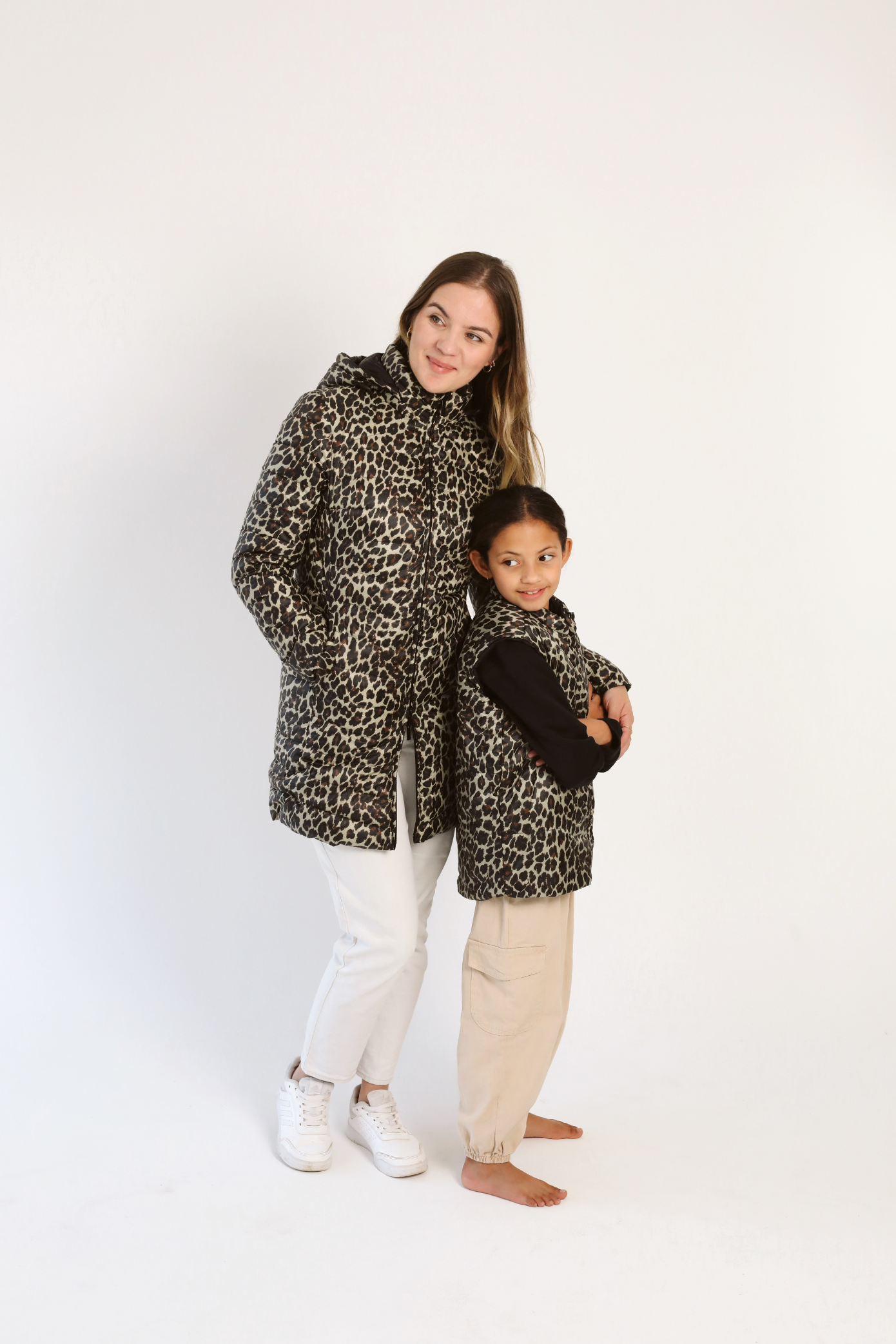 Kids Leopard x Black Gilet™ — sleeveless kids’ puffer vest in bold leopard print with black accents, a fun winter essential in South Africa