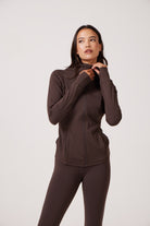 Brown Lightweight performance jacket with a smooth, sculpting fit, full zip front, high collar, and stretch fabric designed for everyday movement and layering.