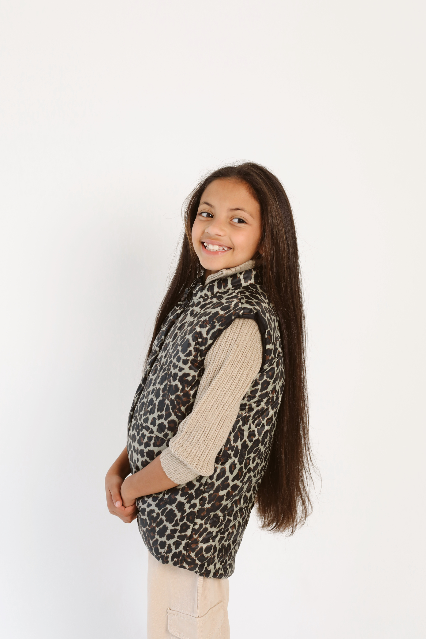 Kids Leopard x Black Gilet™ — sleeveless kids’ puffer vest in bold leopard print with black accents, a fun winter essential in South Africa