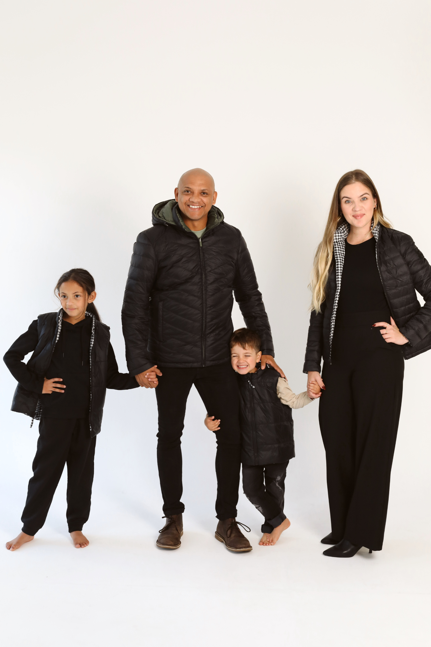 Kids Houndstooth x Black Gilet™ — sleeveless black puffer vest with bold houndstooth print, a versatile winter layer for kids in South Africa