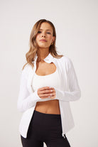 White Lightweight performance jacket with a smooth, sculpting fit, full zip front, high collar, and stretch fabric designed for everyday movement and layering.