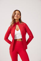 Red Lightweight performance jacket with a smooth, sculpting fit, full zip front, high collar, and stretch fabric designed for everyday movement and layering.