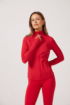 Red Lightweight performance jacket with a smooth, sculpting fit, full zip front, high collar, and stretch fabric designed for everyday movement and layering.