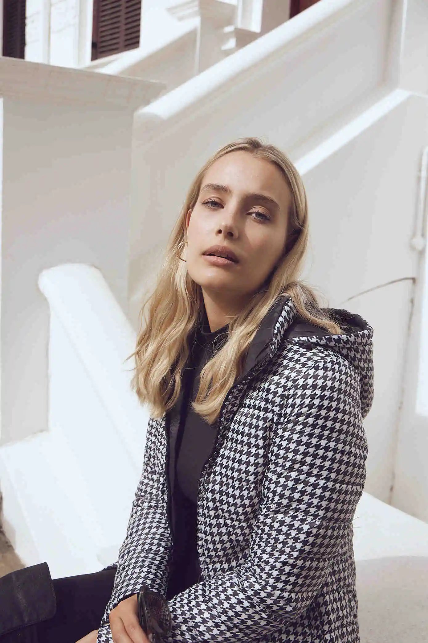 Women’s insulated reversible hooded parka in houndstooth print and midnight black, designed for warmth and comfort in South Africa’s winter season — Midnight x Houndstooth Classic Parka™