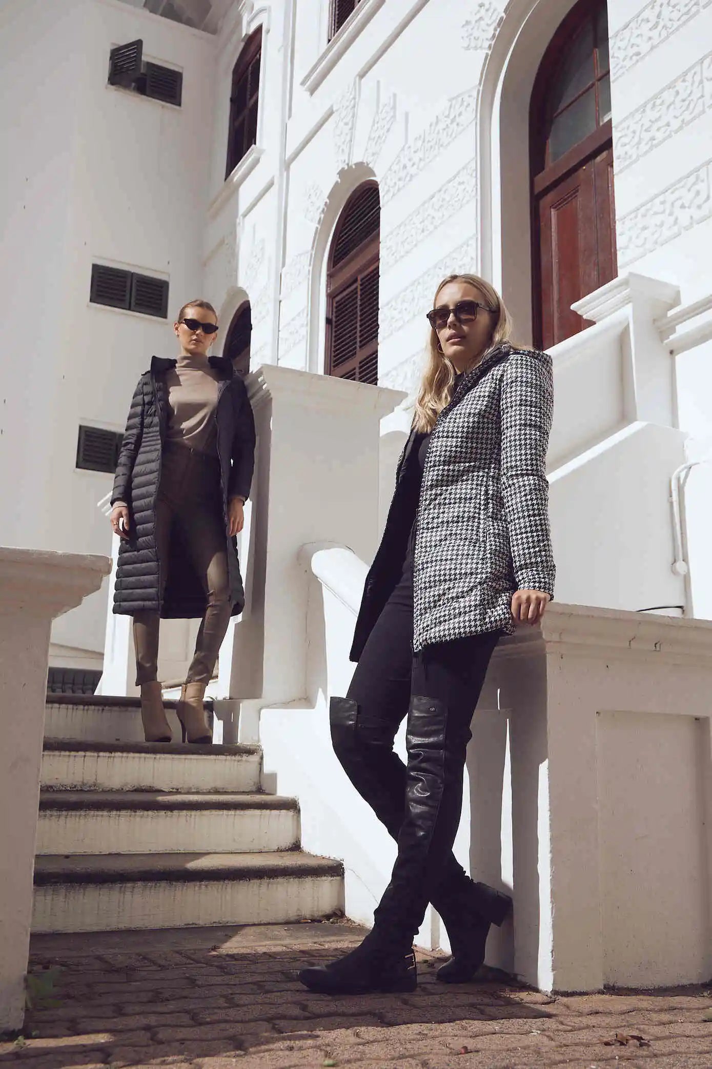 Women’s insulated reversible hooded parka in houndstooth print and midnight black, designed for warmth and comfort in South Africa’s winter season — Midnight x Houndstooth Classic Parka™