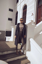 Women’s insulated ultra-length hooded parka in midnight black, designed for extra warmth and comfort in South Africa’s winter season — Midnight Ultra Parka™