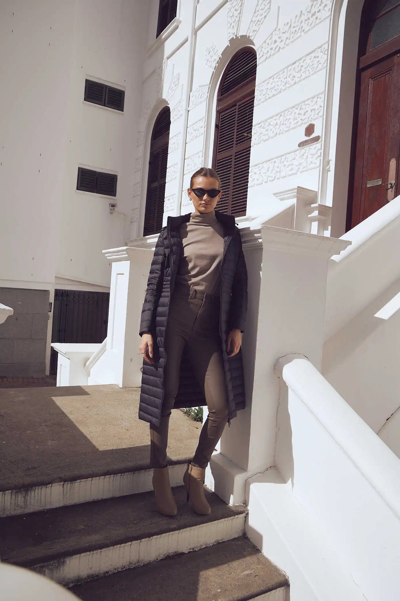 Women’s insulated ultra-length hooded parka in midnight black, designed for extra warmth and comfort in South Africa’s winter season — Midnight Ultra Parka™