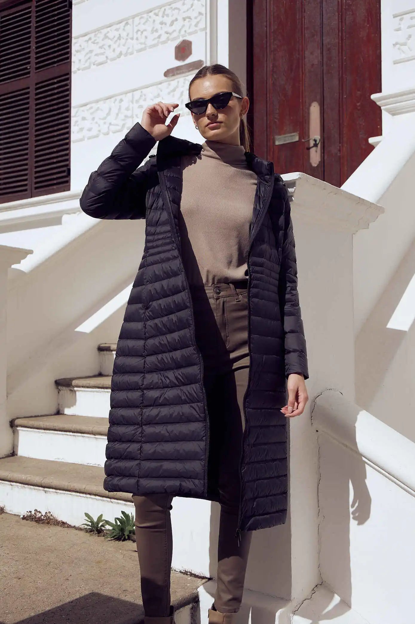 Women’s insulated ultra-length hooded parka in midnight black, designed for extra warmth and comfort in South Africa’s winter season — Midnight Ultra Parka™