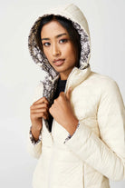 Women’s reversible cream puffer jacket with python-print inner lining and hood, lightweight insulated outerwear from Duck Apparel South Africa