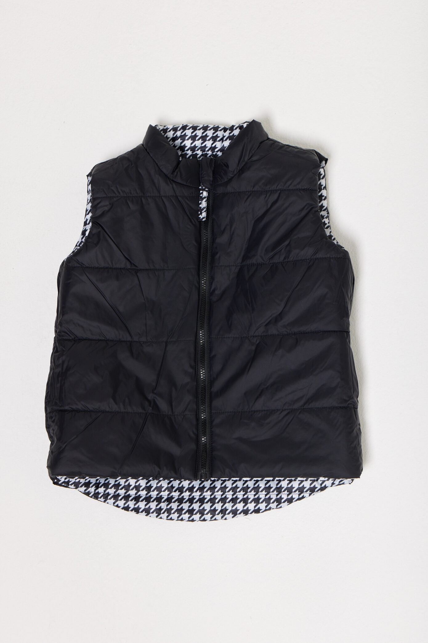 Kids Houndstooth x Black Gilet™ — sleeveless black puffer vest with bold houndstooth print, a versatile winter layer for kids in South Africa