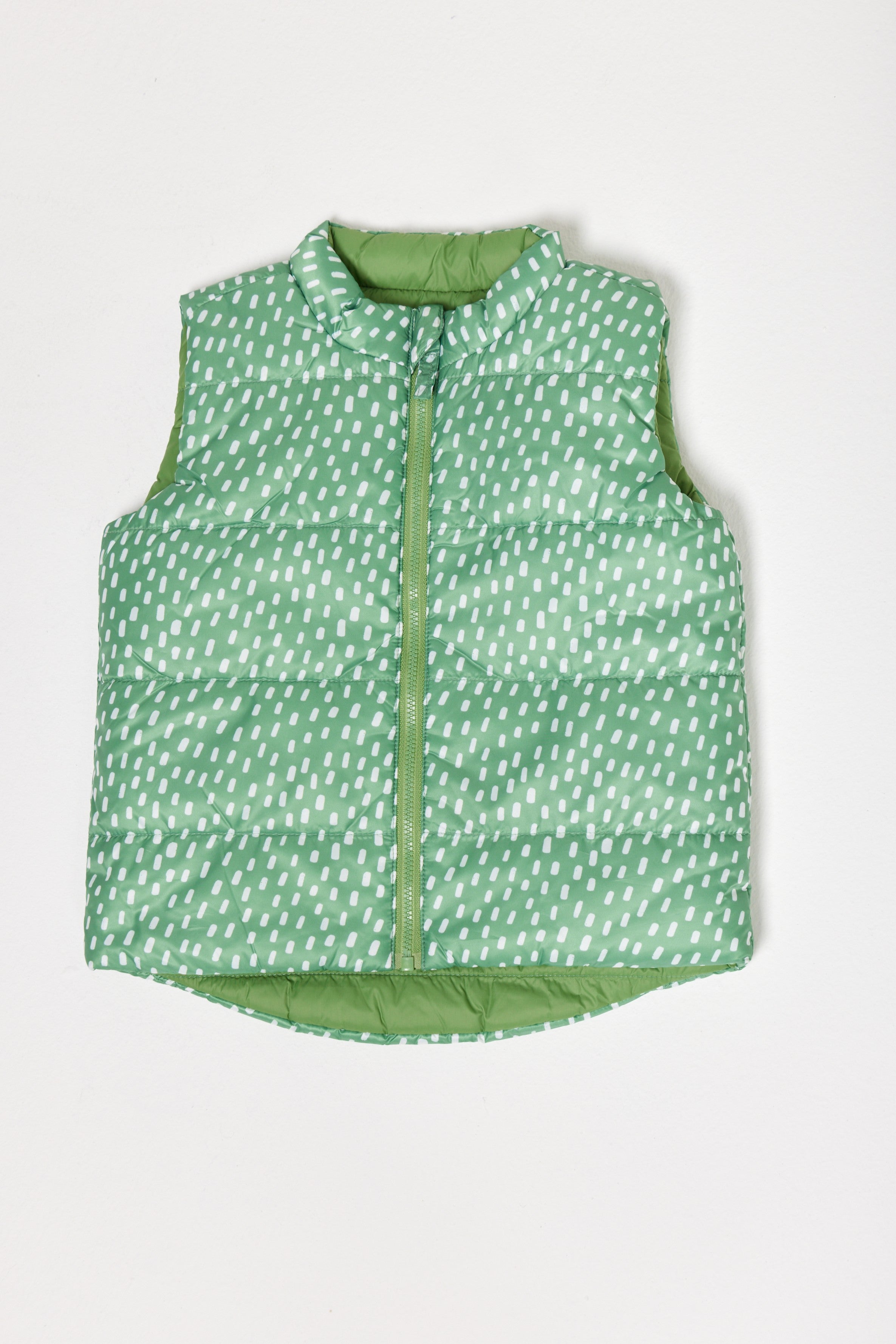 Kids Dots x Green Gilet™ — lightweight sleeveless puffer vest with playful white dot print on green, perfect for layering in South Africa