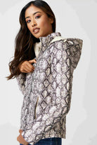 Women’s reversible cream puffer jacket with python-print inner lining and hood, lightweight insulated outerwear from Duck Apparel South Africa