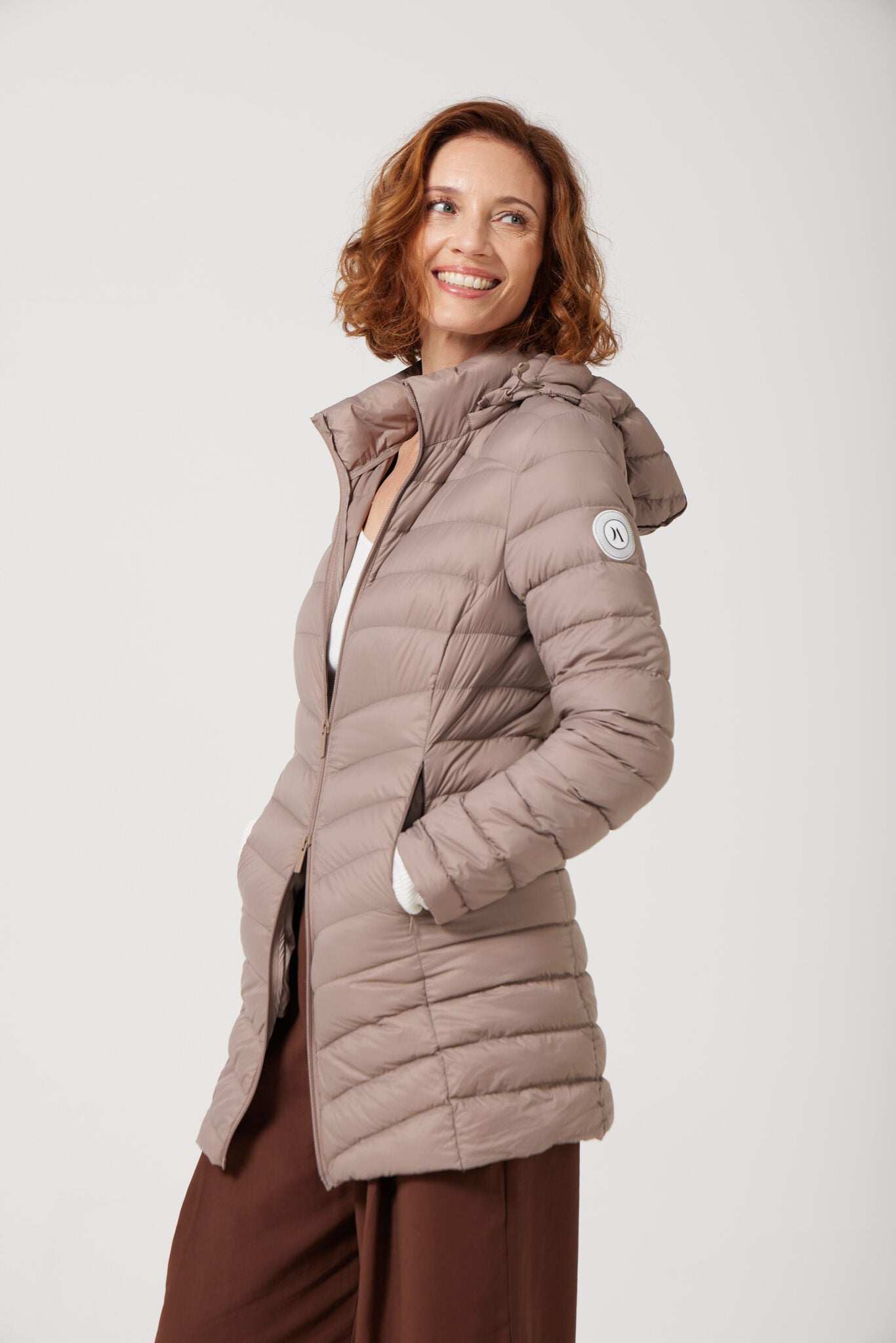 Chai Classic Parka™ in soft beige chai shade, insulated hooded parka designed for warmth and comfort in South Africa’s winter season