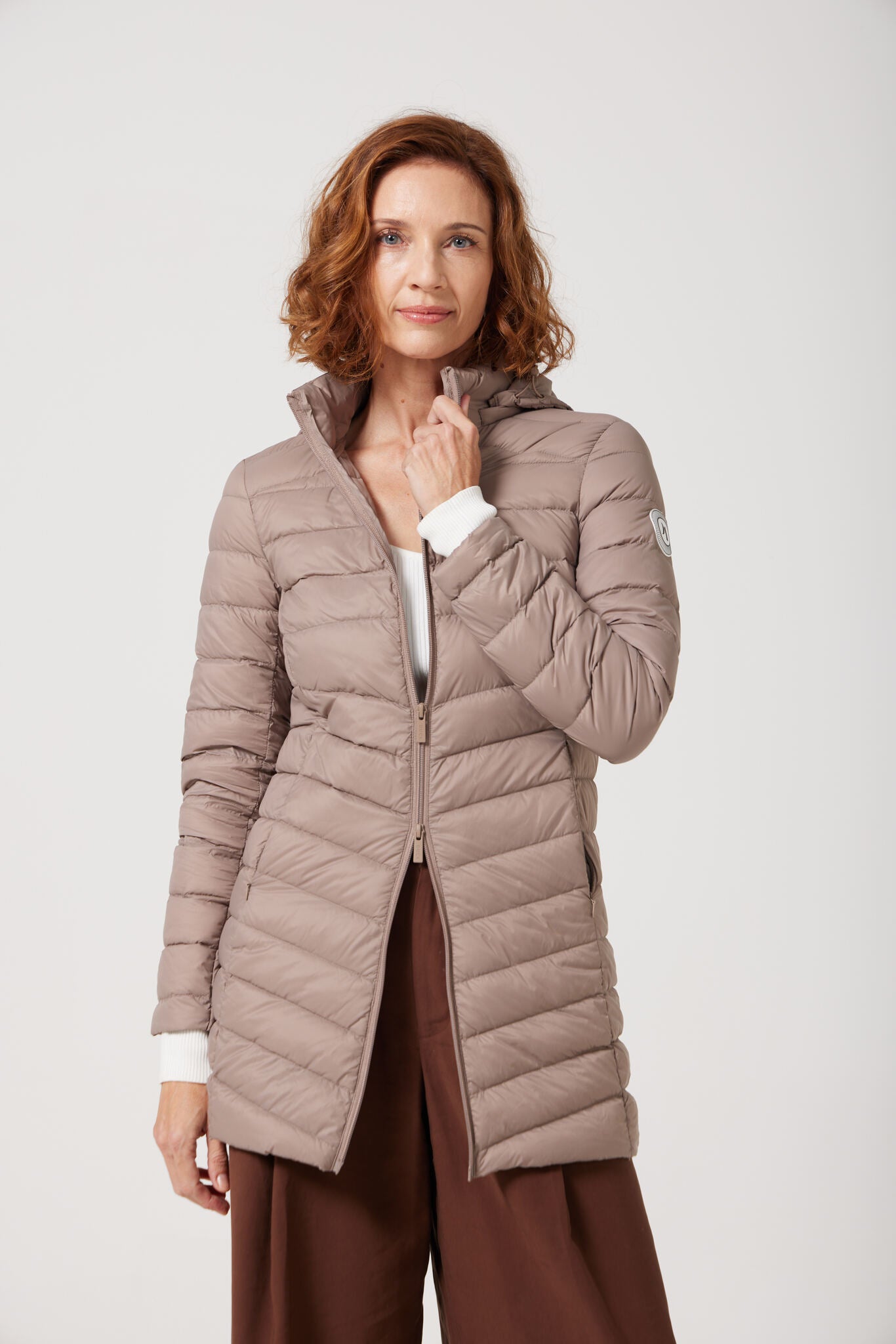 Chai Classic Parka™ in soft beige chai shade, insulated hooded parka designed for warmth and comfort in South Africa’s winter season