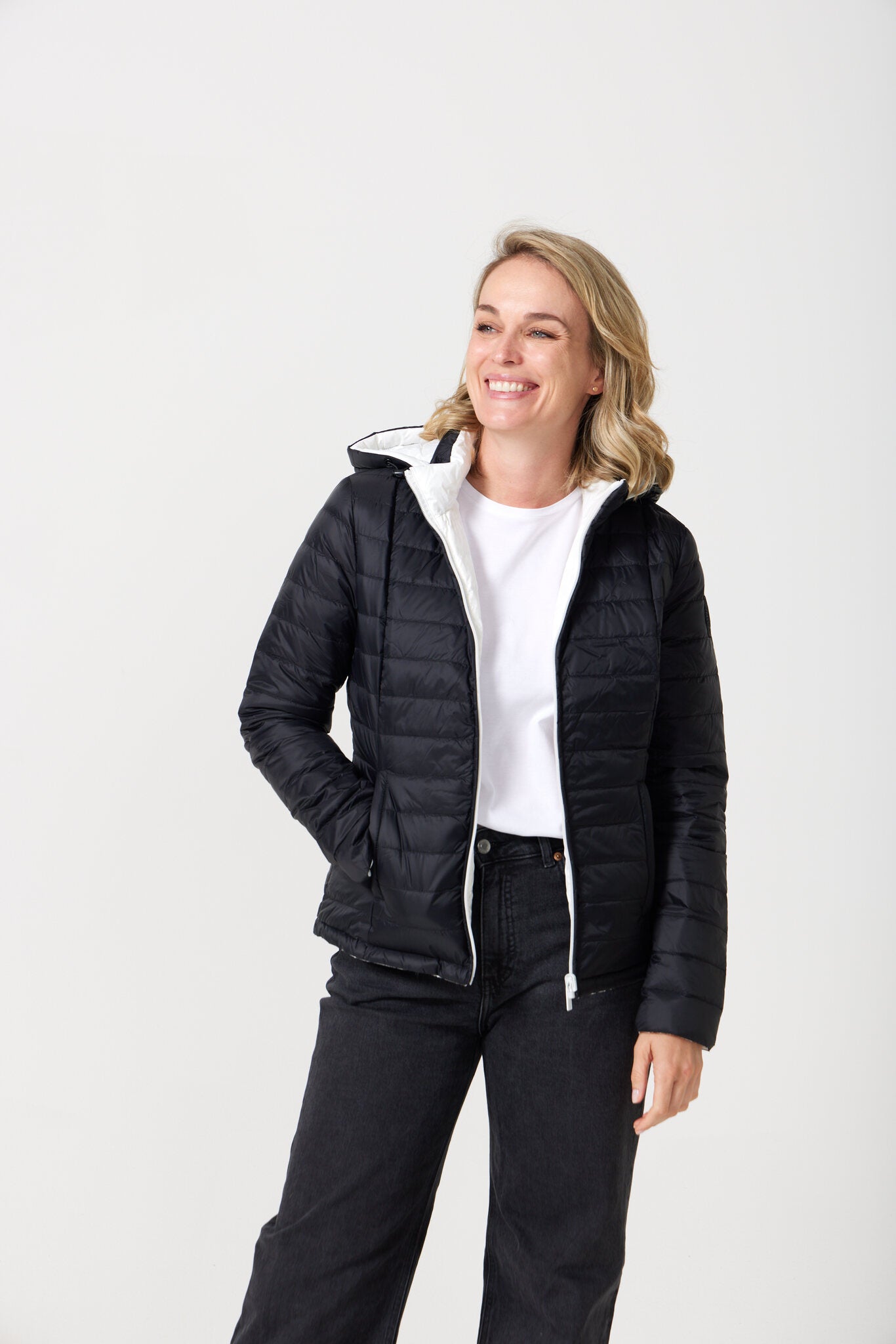 Women’s reversible puffer jacket in white and black, lightweight and warm for layering in South Africa — Midnight x Salt Classic Jacket™