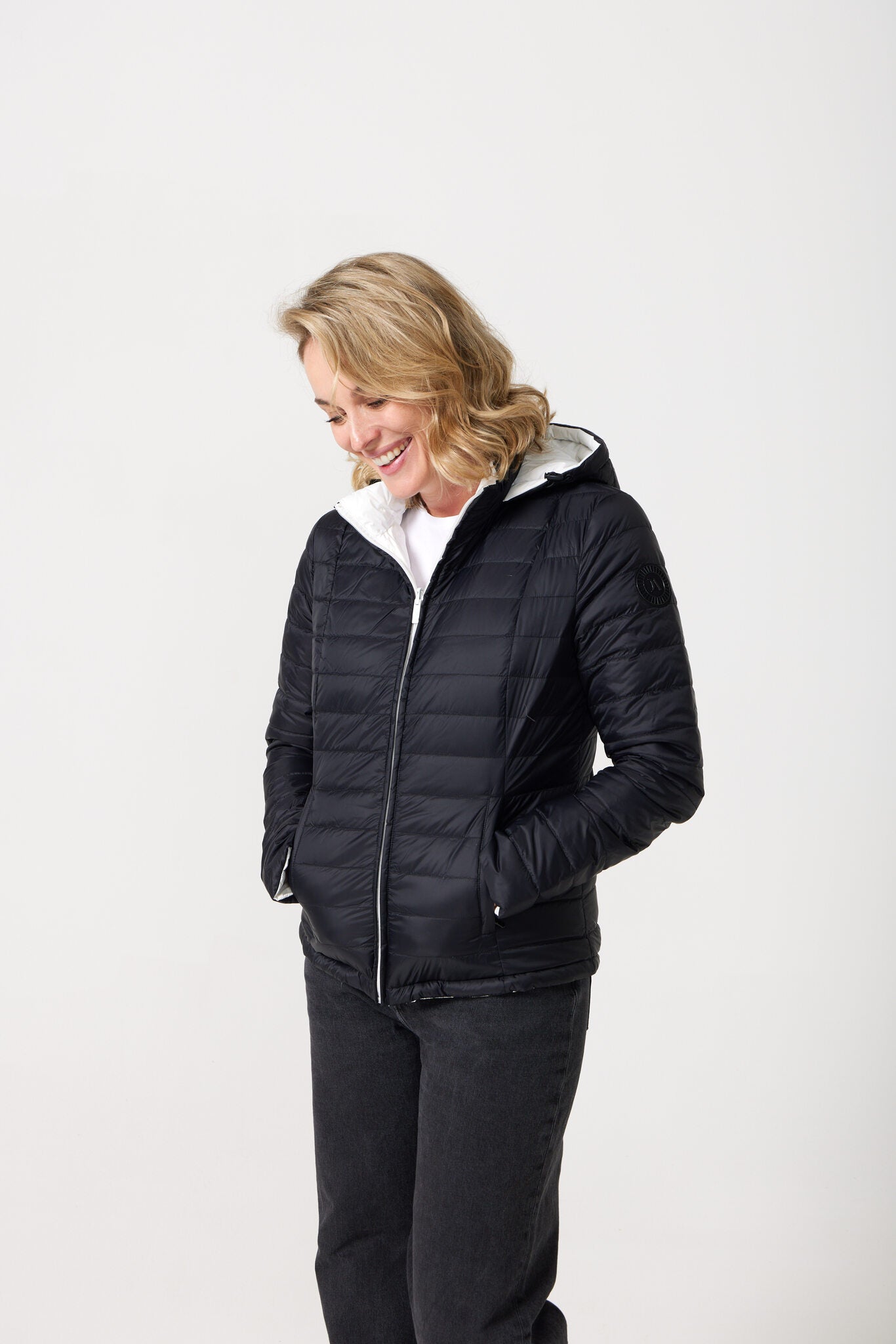 Women’s reversible puffer jacket in white and black, lightweight and warm for layering in South Africa — Midnight x Salt Classic Jacket™