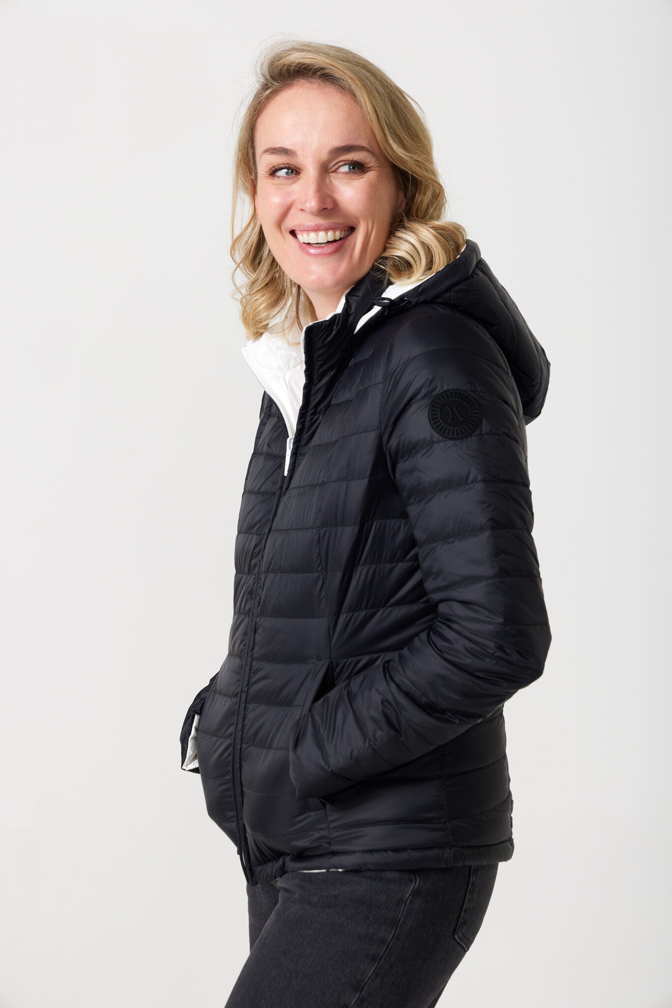 Women’s reversible puffer jacket in white and black, lightweight and warm for layering in South Africa — Midnight x Salt Classic Jacket™