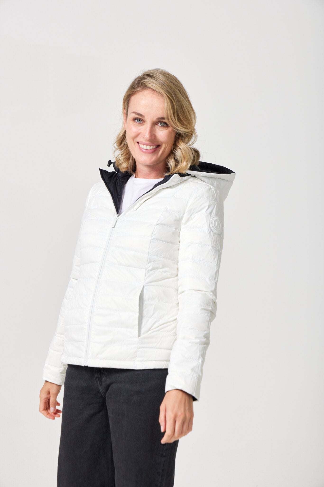 Women’s reversible puffer jacket in white and black, lightweight and warm for layering in South Africa — Midnight x Salt Classic Jacket™