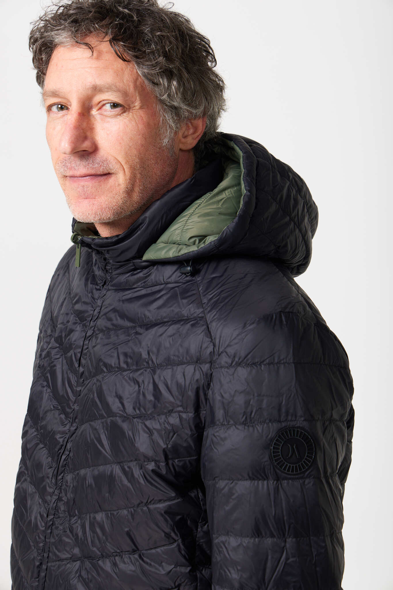 Men’s insulated hooded jacket in reversible sage green and black, lightweight and warm for South Africa’s winter layering — Sage x Black Classic Jacket™