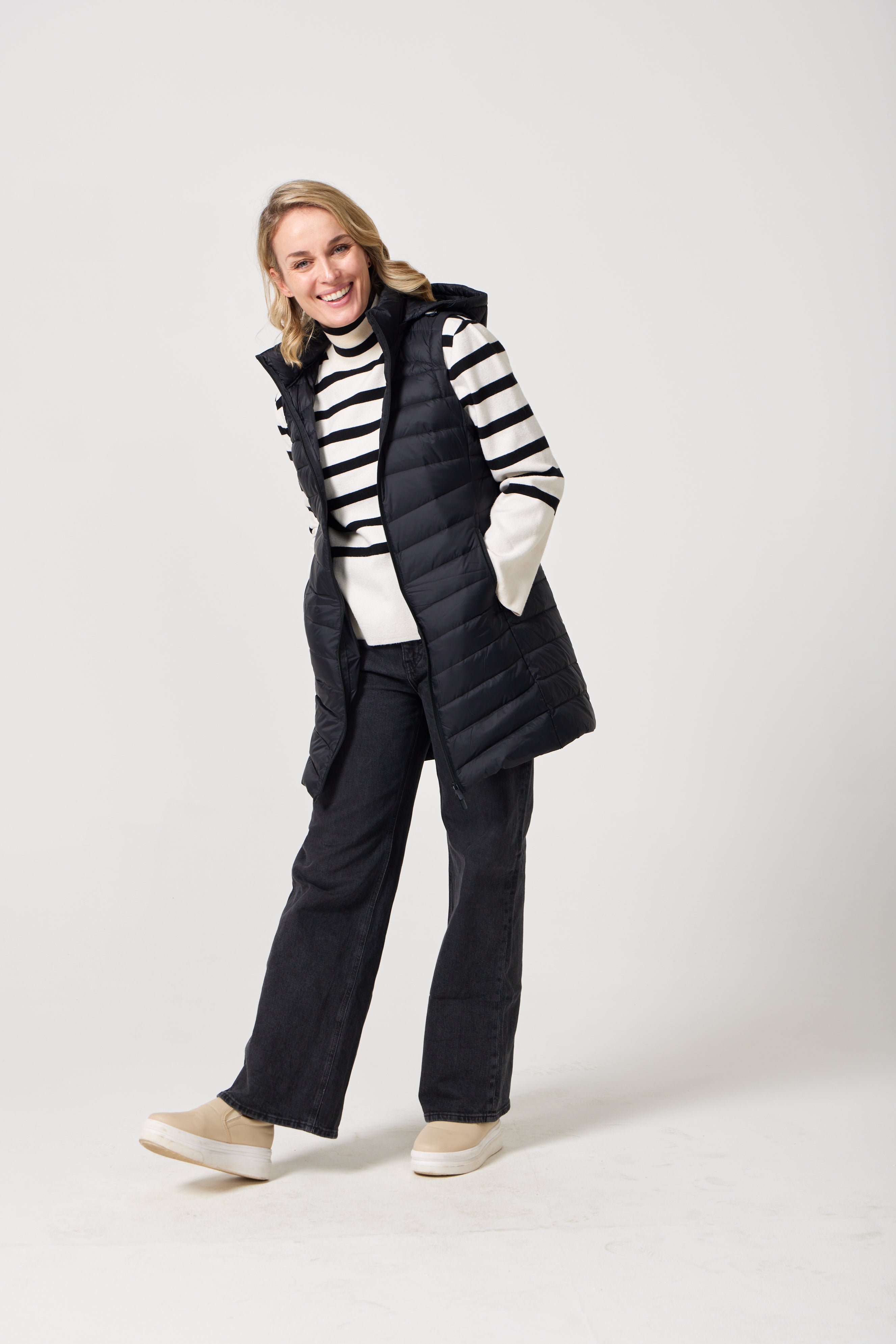 Midnight Longline Gilet™ — women’s sleeveless gilet in black, longline cut with hood, versatile layering piece for winter in South Africa.