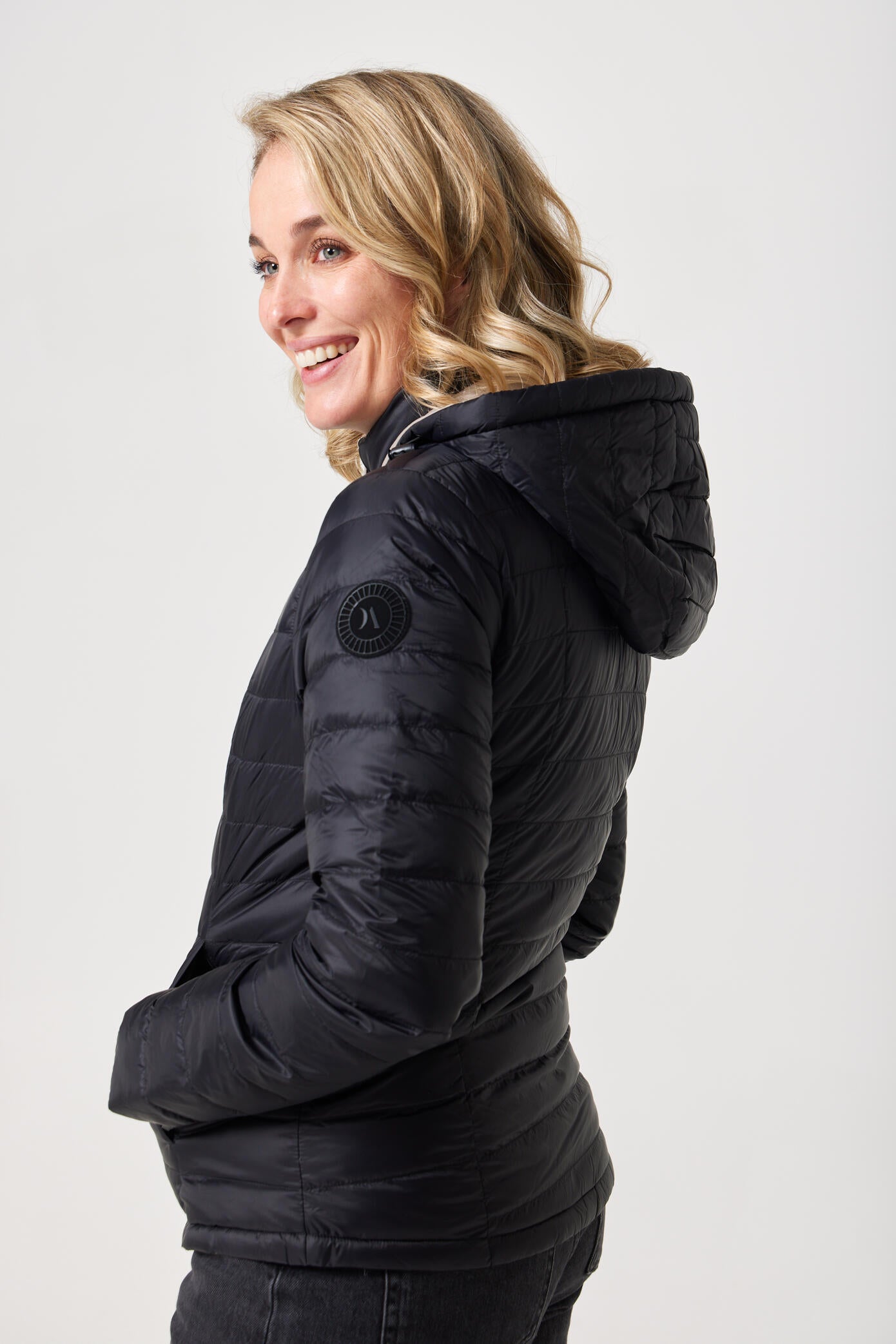 Women’s Ebony x Ivory Classic Jacket™ reversible lightweight puffer in neutral beige and black, versatile outerwear for layering in South Africa