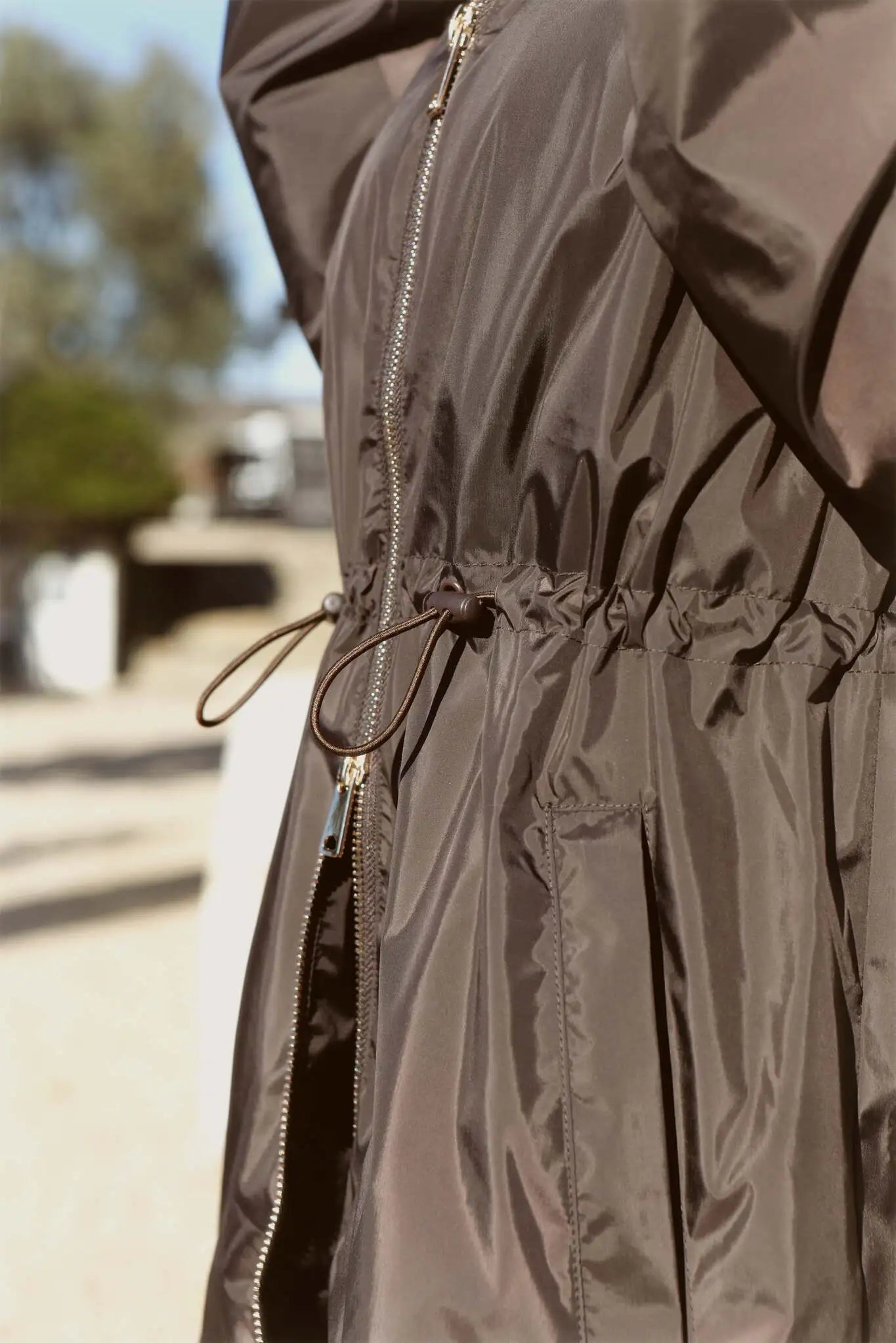 Truffle Haze raincoat in dark brown, lightweight hooded waterproof raincoat ideal for South Africa’s rainy season and wet climate