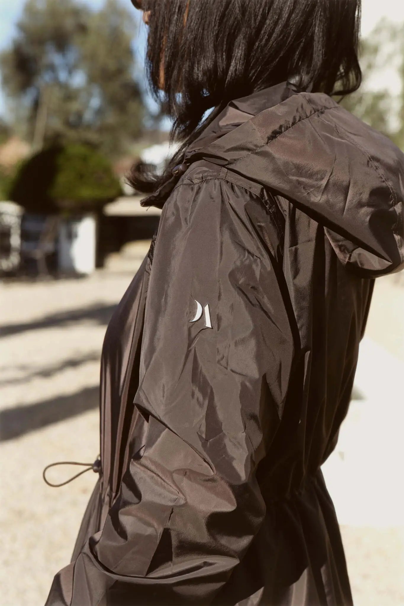 Truffle Haze raincoat in dark brown, lightweight hooded waterproof raincoat ideal for South Africa’s rainy season and wet climate