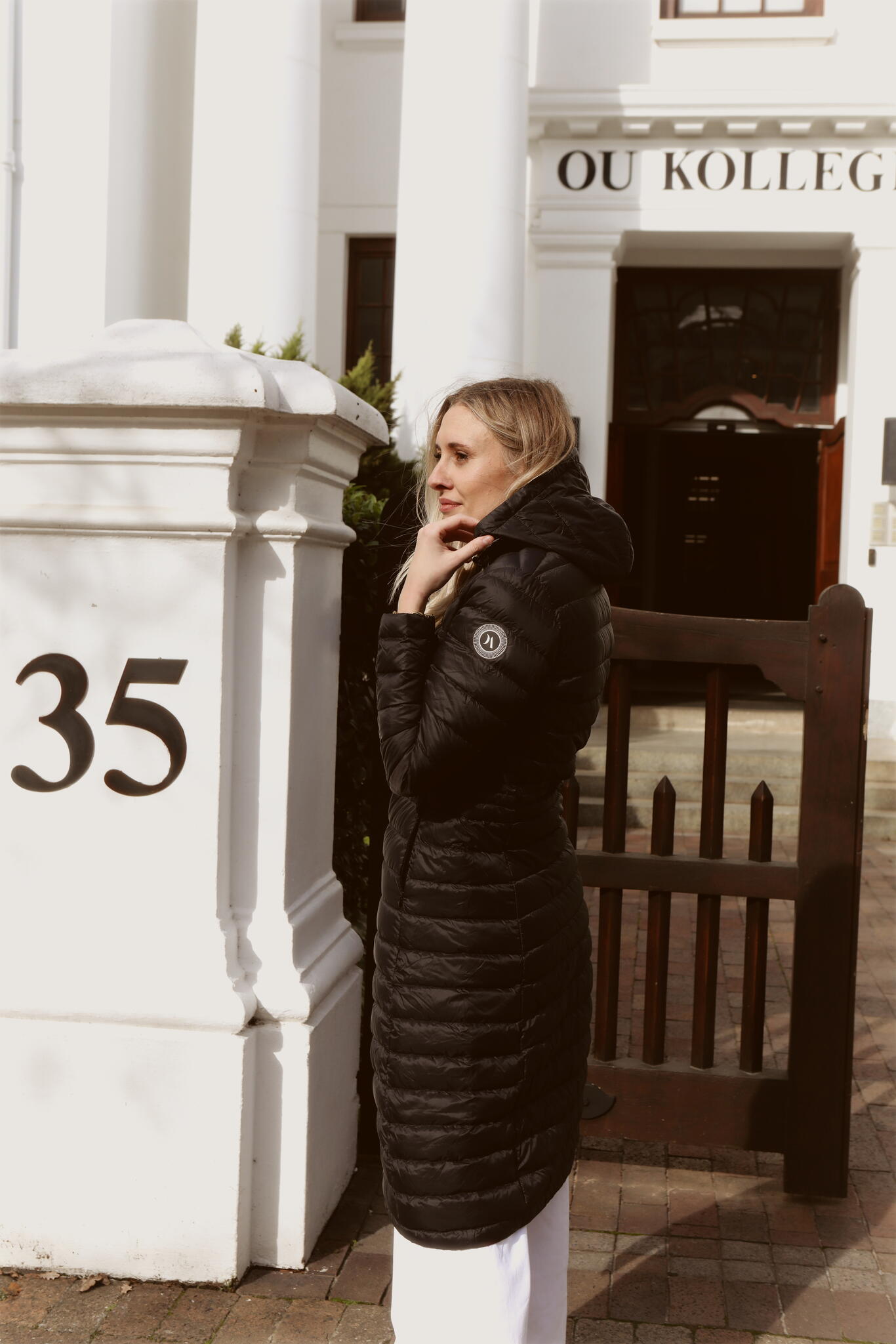 Women’s insulated ultra-length hooded parka in midnight black, designed for extra warmth and comfort in South Africa’s winter season — Midnight Ultra Parka™